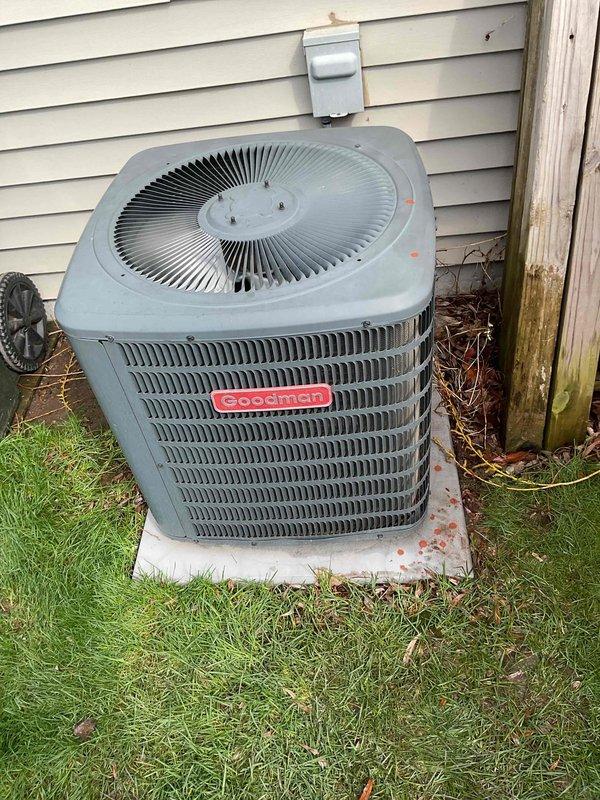 Responded to no cooling complaint on first use of season for Goodman air conditioning system. Customer had already replaced furnace filter prior to arrival. Performed exterior coil cleaning by rinsing down condenser unit to remove accumulated debris. Tested contactor relay operation and confirmed proper functionality. Measured refrigerant charge and found system running low. Added refrigerant to bring system to proper operating levels and verified cooling operation restored.