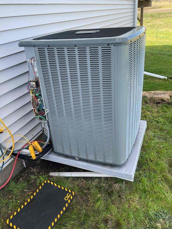 Performed A/C clean and check tune-up on outdoor condenser unit. Inspected electrical components including capacitor and wiring, which were found to be in good condition. Unable to complete refrigerant level testing due to ambient temperature being too cold for system operation. Recommended customer replace air filter and scheduled follow-up visit during warmer weather to test and verify refrigerant charge levels.