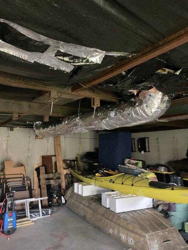 Completed installation of supply ductwork runs in basement area, including proper routing of flexible duct through floor joists and application of foil-wrapped insulation to all new supply lines. All ductwork was secured to structural members and insulated to code specifications to ensure proper airflow and energy efficiency throughout the system.