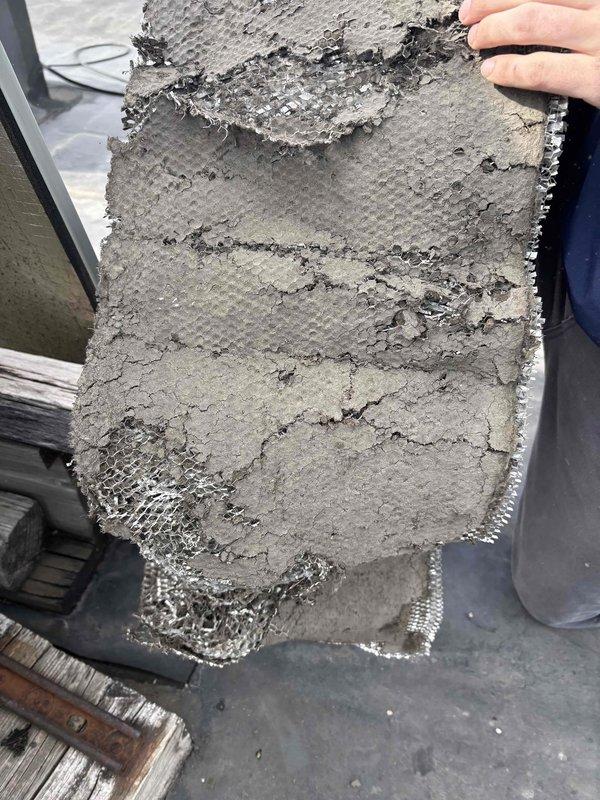 Responded to no cooling complaint on rooftop package unit serving kitchen area. Upon inspection, found severely clogged air filter restricting airflow to the system. Removed and replaced heavily contaminated filter with substantial dust and debris buildup that had accumulated over extended period. Filter obstruction was preventing proper air circulation through the Trane package unit, resulting in inadequate cooling performance. Unit tested after filter replacement and confirmed restored airflow and proper cooling operation.