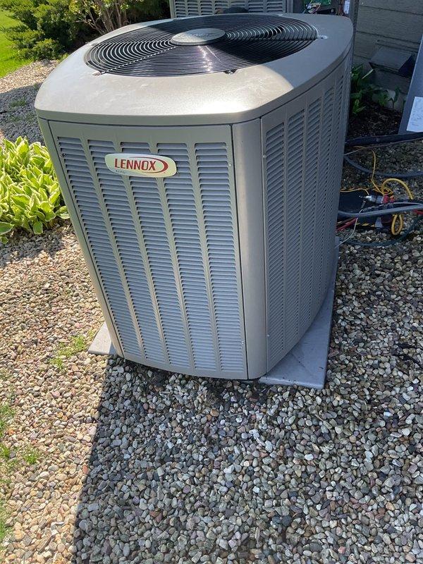 Responded to no cooling condition with error code 411 low pressure lockout on dual AC system. Found both outdoor condenser units heavily soiled with accumulated dirt and debris from lack of maintenance over previous two years. Performed thorough cleaning of both condenser coils and units to restore proper airflow and heat transfer. Upon completion of cleaning, conducted operational testing of both systems. Unit #1 measured 15°F delta T and Unit #2 measured 19°F delta T, both within acceptable cooling performance parameters. Performed complete system inspection and checkout on both units to verify proper operation and clearance of fault codes.