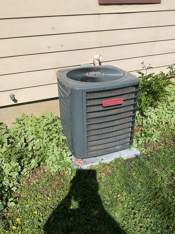 Completed comprehensive cooling system tune-up on residential air conditioning unit. Performed condenser coil cleaning, verified condensate drain line was clear and flowing properly, and replaced air filter. System operating within factory specifications with 21-degree temperature split across evaporator coil, indicating proper refrigerant charge and airflow.