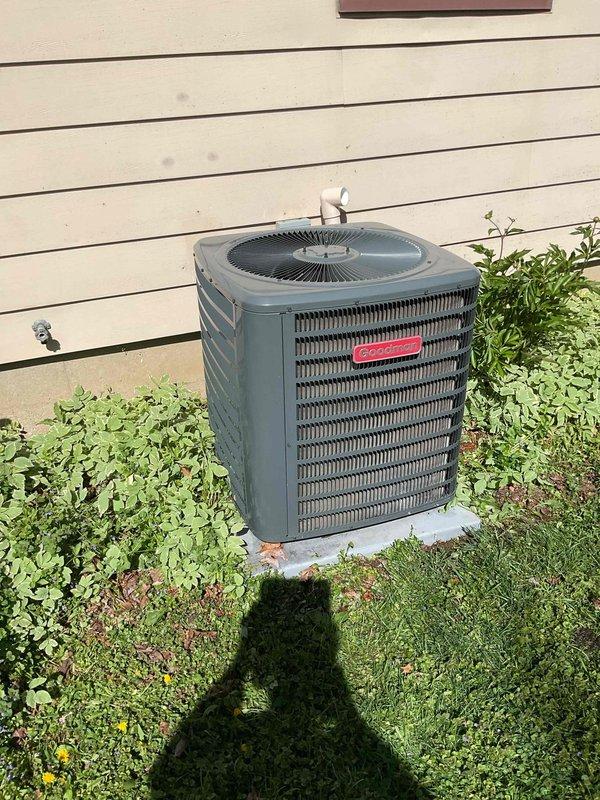 Completed comprehensive cooling system tune-up on residential air conditioning unit. Performed condenser coil cleaning, verified condensate drain line was clear and flowing properly, and replaced air filter. System operating within factory specifications with 21-degree temperature split across evaporator coil, indicating proper refrigerant charge and airflow.