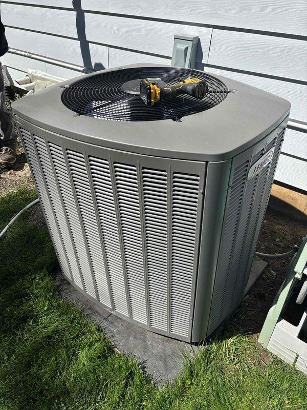 Performed comprehensive air conditioning maintenance and inspection on residential condensing unit. Cleaned condenser coil, verified proper airflow through louvered cabinet, and confirmed all mechanical components operating within normal parameters. Temperature differential measurements taken at 42.0°F and 24.4°F indicated system achieving appropriate cooling performance with no deficiencies noted.