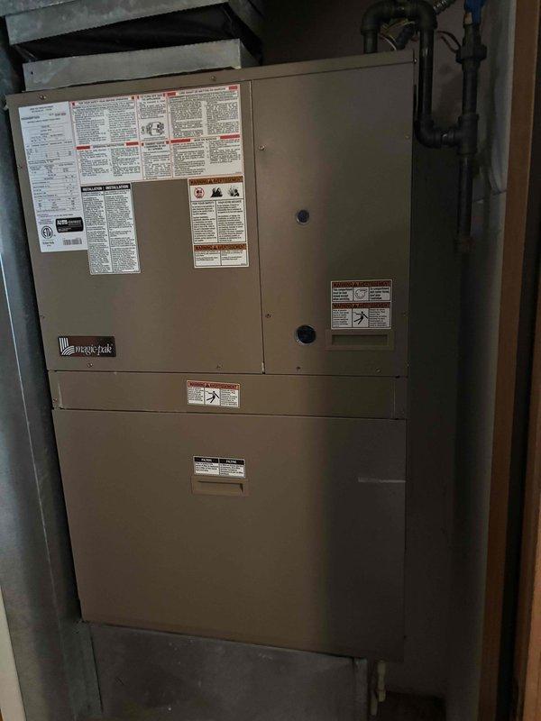 Responded to a no cooling call on a Magic-Pak HVAC system. Upon inspection, discovered a bent pin in the thermostat preventing the air conditioning from engaging while heating function remained operational. Straightened the damaged thermostat pin, restoring full system functionality and resolving the cooling issue.