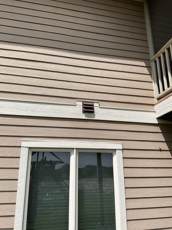 Responded to service call regarding exterior wall vent with bird intrusion issue. Upon inspection, found damaged vent cover on residential exterior allowing wildlife access to ductwork system. Removed compromised vent grille from siding-mounted opening and replaced with new white louvered vent cover featuring proper screening to prevent future bird entry while maintaining adequate airflow. Verified secure mounting and proper seal to building envelope.