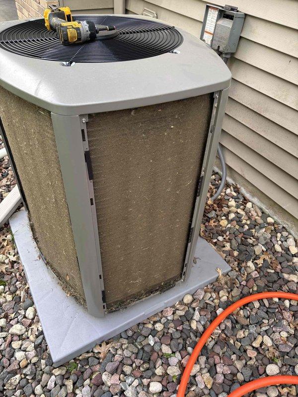 Completed prepaid clean and check maintenance on residential air conditioning system. Performed thorough cleaning of outdoor condenser unit, removing accumulated dust, debris, and grime from mesh filter panels and coil surfaces. Inspected condenser fan operation, electrical connections at disconnect box, and refrigerant line set. Verified proper drainage through condensate lines and checked all exterior components for wear or damage. Unit operational and running within normal parameters upon completion of maintenance service.