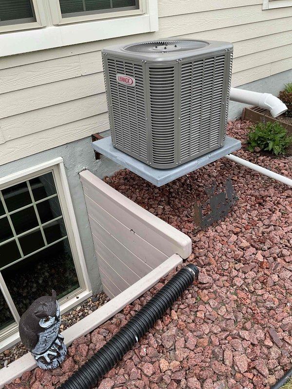 Performed comprehensive air conditioning tune-up on residential Lennox condenser unit. Conducted thorough system cleaning and operational inspection, confirming proper refrigerant charge levels, capacitor functionality, and contactor operation. All components tested within normal parameters and unit operating efficiently.