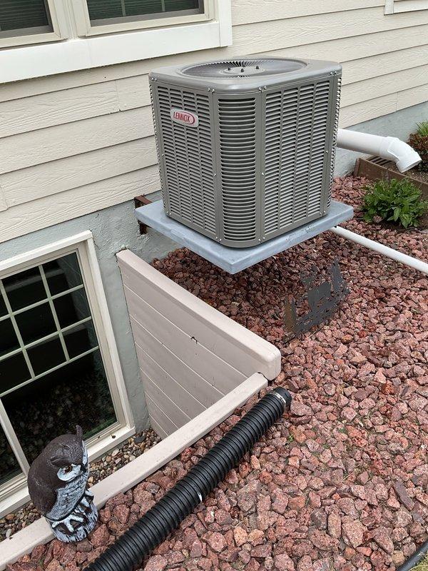 Performed comprehensive air conditioning tune-up on residential Lennox condenser unit. Conducted thorough system cleaning and operational inspection, confirming proper refrigerant charge levels, capacitor functionality, and contactor operation. All components tested within normal parameters and unit operating efficiently.