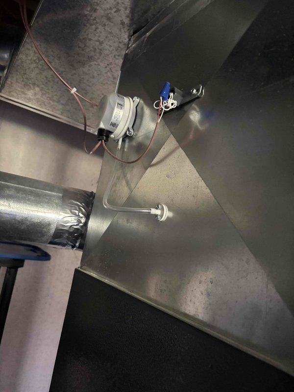 Returned to complete check and charge service that was previously interrupted due to cold ambient temperatures. Rechecked refrigerant charge on system and verified proper levels. Inspected motorized damper actuator installation and wiring connections in ductwork. Verified control board operation with all LED indicators functioning properly. System operating within normal parameters.