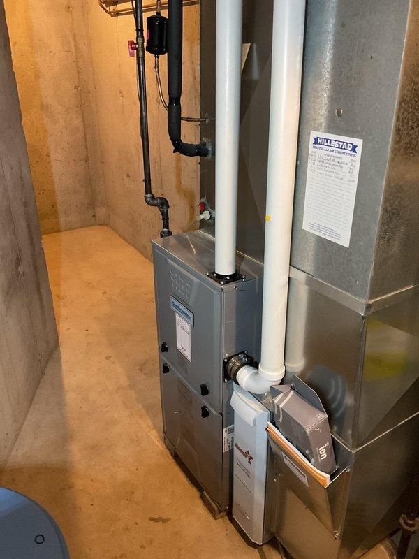 Completed comprehensive furnace clean and check, AC clean and check, and humidifier maintenance on newer HVAC system. Rinsed condenser coil thoroughly and verified system performance with subcooling measured at 11 degrees as specified by manufacturer requirements. Cleaned exterior components, inspected all equipment including furnace, air handler, and humidifier, and confirmed proper operation of digital thermostat set to heating mode.