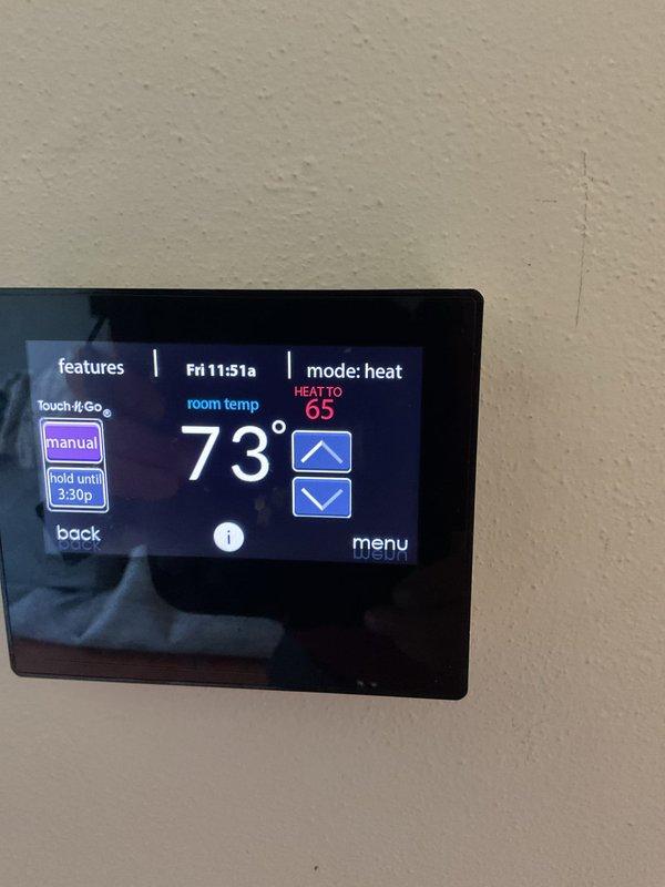 Completed comprehensive furnace clean and check, AC clean and check, and humidifier maintenance on newer HVAC system. Rinsed condenser coil thoroughly and verified system performance with subcooling measured at 11 degrees as specified by manufacturer requirements. Cleaned exterior components, inspected all equipment including furnace, air handler, and humidifier, and confirmed proper operation of digital thermostat set to heating mode.