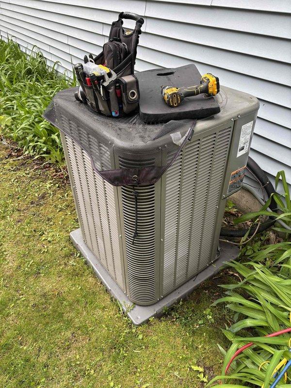 Completed seasonal air conditioning clean and check maintenance service on residential outdoor condensing unit. Performed comprehensive system inspection, verified proper operation of all components, and confirmed temperature differentials within acceptable range using digital thermometers (supply air 48.7°F, return air 66.2°F). Unit operating normally with no deficiencies noted.