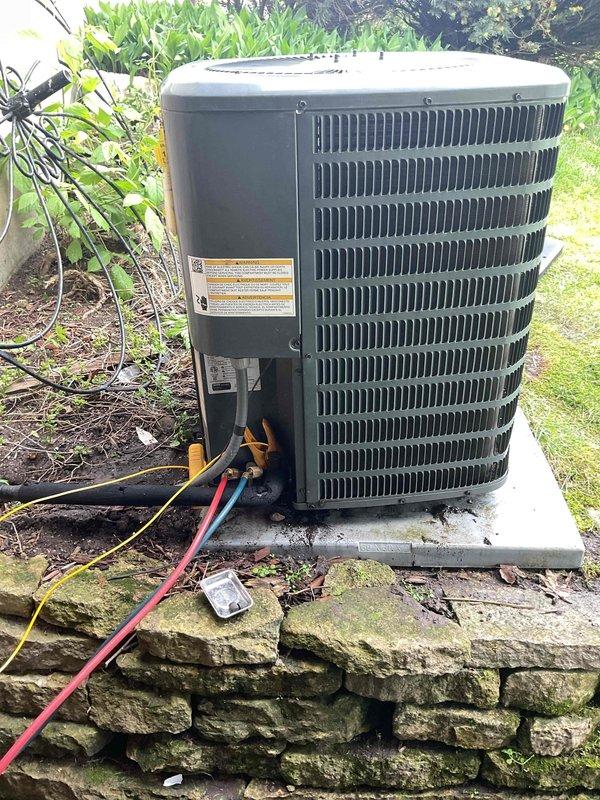 Performed comprehensive air conditioning tune-up on outdoor condenser unit, including complete system cleaning and inspection. Identified and replaced failing capacitor that was reading below specification, then installed customer-provided air filter. All refrigerant lines, electrical connections, and system components were inspected and found operating within normal parameters following capacitor replacement.