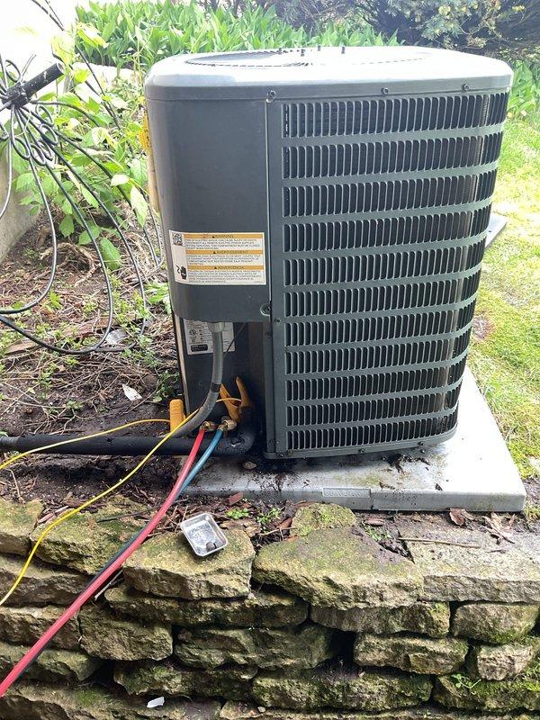 Performed comprehensive air conditioning tune-up on outdoor condenser unit, including complete system cleaning and inspection. Identified and replaced failing capacitor that was reading below specification, then installed customer-provided air filter. All refrigerant lines, electrical connections, and system components were inspected and found operating within normal parameters following capacitor replacement.