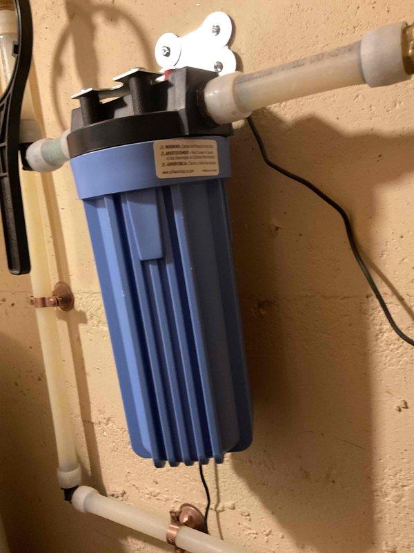 Completed spring AC clean and check as part of maintenance package. Air conditioning system operating properly with no issues found. Inspected furnace filter during visit. Customer inquired about installing a pressure reducing valve for whole house water system; existing water treatment infrastructure includes Culligan water softener and blue filtration unit with PVC plumbing connections.
