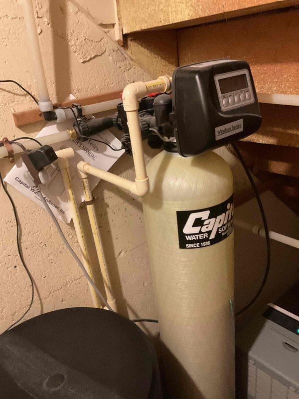 Completed spring AC clean and check as part of maintenance package. Air conditioning system operating properly with no issues found. Inspected furnace filter during visit. Customer inquired about installing a pressure reducing valve for whole house water system; existing water treatment infrastructure includes Culligan water softener and blue filtration unit with PVC plumbing connections.