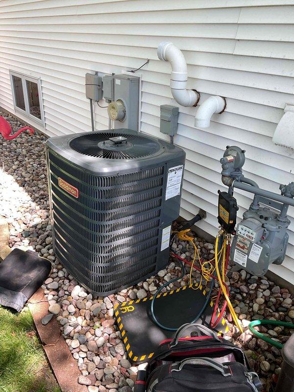 Performed comprehensive clean and check service on Goodman air conditioning system. Unit was found in good operating condition with capacitor and contactor testing within normal specifications. System was slightly overcharged; refrigerant levels were adjusted to manufacturer specifications. Completed standard maintenance procedures and verified proper system operation.