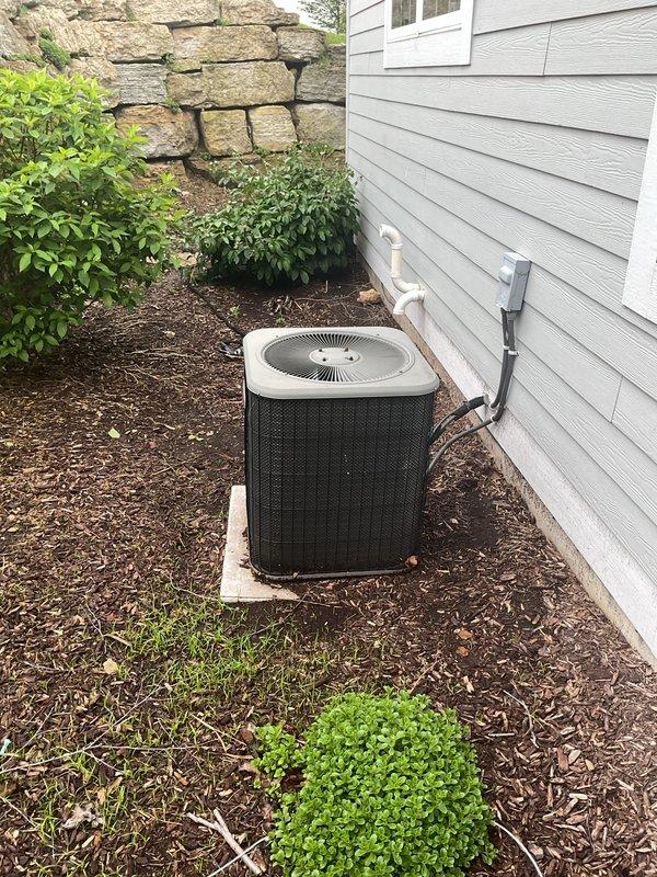 Performed complete air conditioning clean and check on outdoor condensing unit. Verified refrigerant charge within manufacturer specifications, inspected and tested contactor and capacitor with all components operating properly. System operating efficiently with no issues found.