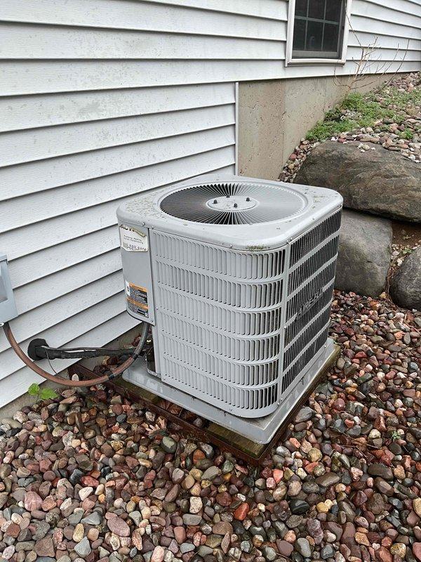 Responded to service call for residential air conditioning system not producing cold air. Upon inspection, found condenser unit operational with fan running but insufficient cooling output. Diagnosed system as low on refrigerant charge. Added refrigerant to manufacturer specifications and performed cleaning of condensing coil to restore proper heat transfer efficiency. System tested and confirmed returning to normal cooling operation upon completion.