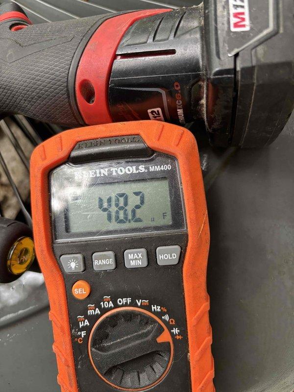 Performed comprehensive air conditioning clean and check service. Found condenser coil heavily soiled with dirt and debris accumulation, restricting airflow and reducing system efficiency. Thoroughly cleaned condenser coil to restore proper heat transfer capability. Diagnostic testing revealed low refrigerant charge in the system. Added 1 pound of R-410A refrigerant to bring system to proper operating levels. Verified system pressures and temperatures after charging. Inspected drain pan and found typical debris accumulation; unit now operating within manufacturer specifications.