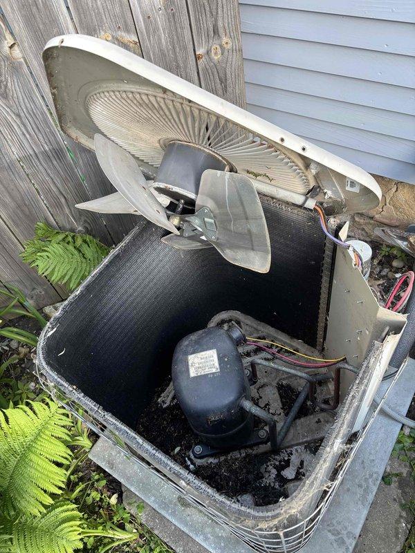 # HVAC Maintenance Completed

Performed comprehensive air conditioning clean and check on outdoor condensing unit. Upon inspection, found heavily soiled condenser coil with significant debris accumulation and a clogged condensate drain line restricting proper drainage.

Removed top panel to access internal components and thoroughly cleaned the outdoor condenser coil to restore proper airflow and heat transfer efficiency. Cleared the obstructed drain hose to ensure proper condensate removal and prevent potential water damage or system shutdown. Unit tested and operating within normal parameters upon completion.