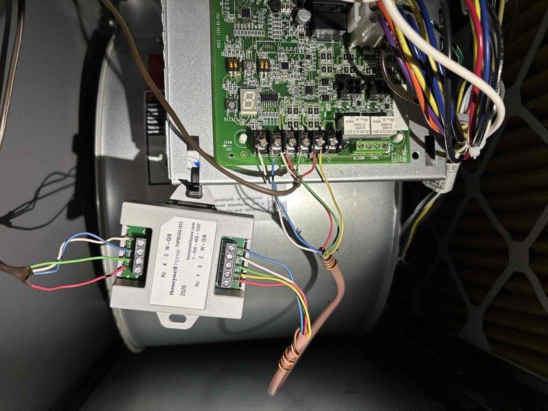 Responded to warranty callback regarding air conditioning system not operational following recent furnace and thermostat installation. Upon inspection, determined the air conditioning unit was not properly connected to the newly installed thermostat due to incorrect wiring configuration. Corrected the miswiring issue and installed a C-wire adapter to provide proper 24-volt power supply for thermostat communication with both heating and cooling equipment. Verified all connections at the furnace control board and thermostat, ensuring proper integration of both HVAC systems. Tested system operation to confirm air conditioning unit now responds correctly to thermostat cooling calls.