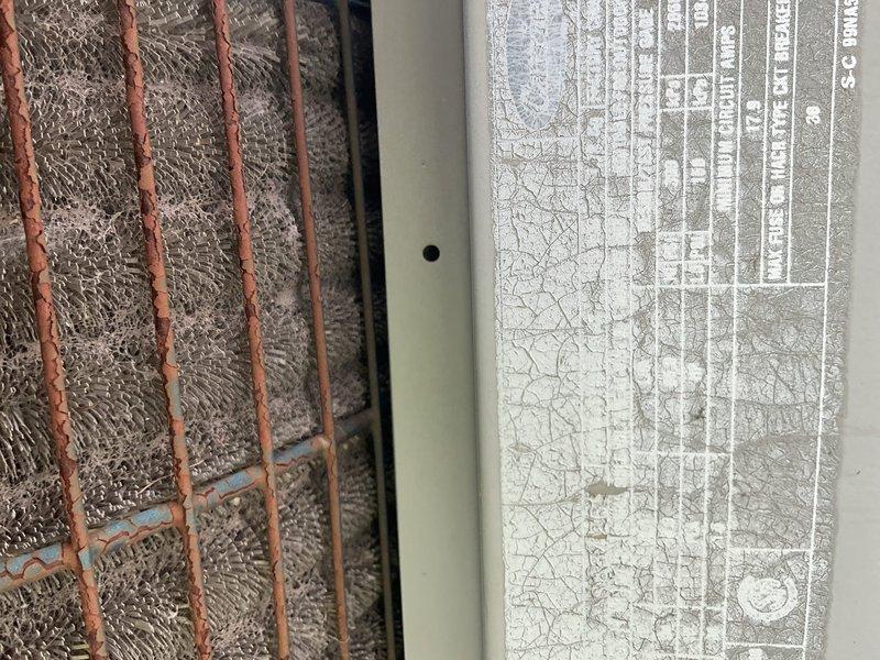 Responded to no cooling complaint on residential air conditioning system. Upon arrival, found heavily corroded outdoor condenser unit with significant rust deterioration on exterior grille and cabinet, indicating advanced age and weathering. System evaluation confirmed unit was inoperative and beyond economical repair. Assessed refrigerant lines and ductwork components. Determined complete system replacement necessary due to age, condition, and failure to provide adequate cooling. Recommended new air conditioning installation to restore comfort and efficiency.