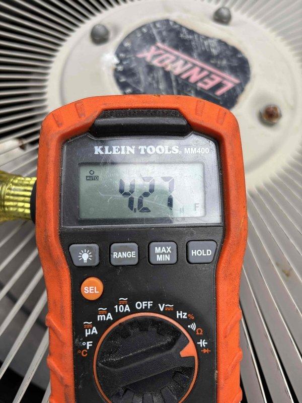 Performed routine A/C clean and check on R22 system. Unit exhibited icing after 25 minutes of runtime due to dirty condenser coil and low refrigerant charge. Cleaned coil thoroughly to restore proper airflow and heat transfer. Measured system temperature at 42.1°F during diagnostics. Due to age of R22 equipment, low refrigerant levels, and phase-out of R22 refrigerant, recommended system replacement to customer rather than recharging refrigerant.