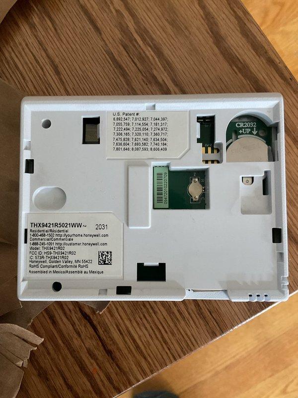 Responded to no-start condition on residential air conditioning system. Upon arrival, found Honeywell thermostat (model THX9421R5021WW) with depleted battery preventing system communication. Replaced CR2032 battery in thermostat, restored power to unit, and verified proper operation of Bryant HVAC system. System now functioning normally with thermostat communicating effectively with equipment.