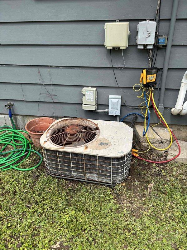 Completed comprehensive clean and check maintenance on both furnace and air conditioning system. Cleaned dirty flame sensing rod on furnace to ensure proper ignition and safety operation. Cleaned heavily soiled condenser coil on outdoor AC unit to restore proper heat transfer and system efficiency. Tested capacitor and found readings slightly below optimal range; recommended replacement to prevent future compressor failure, but homeowner declined service at this time.