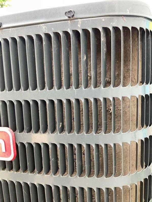 Responded to no-cooling complaint with reported humming noise from HVAC system. Upon inspection, diagnosed failed blower motor with locked rotor preventing air circulation. Evaluated indoor furnace unit and identified significant heat exchanger corrosion presenting safety concerns. Documented existing outdoor condenser unit condition showing normal operational wear and debris accumulation on coil fins. Recommended complete furnace replacement due to compromised heat exchanger integrity and blower motor failure.