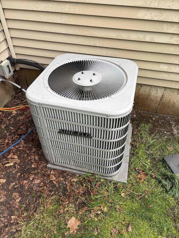 Completed routine air conditioning maintenance and tune-up on residential outdoor condenser unit. Performed system inspection, cleaned condenser coils, checked refrigerant levels, and verified proper operation with temperature readings showing adequate cooling performance. Unit is currently functioning properly, though customer was previously advised that replacement may be needed within the next year.