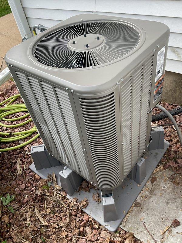 Performed startup service on recently installed air conditioning system. Found unit significantly overcharged with refrigerant showing 35°F subcooling; removed excess refrigerant to achieve proper 6°F subcooling. Repaired humidifier drain line and conducted full system operational testing to verify proper performance.
