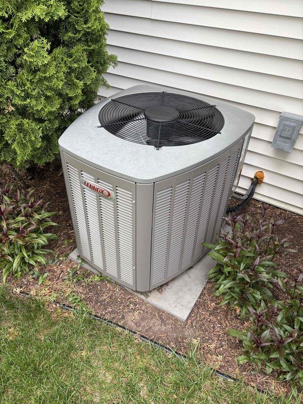 Completed air conditioning check and clean maintenance service on residential Lennox condenser unit. System inspected, temperatures measured and verified within normal operating parameters, unit found to be functioning properly with no issues identified requiring repair or follow-up.