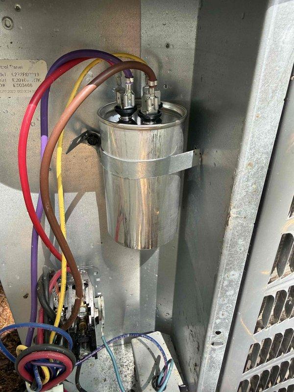 Performed AC clean and check on 410A refrigerant system. Found dirty condenser coil which was thoroughly cleaned to restore proper heat transfer efficiency. Identified leaking Schrader valve causing refrigerant loss; tightened valve to stop leak. System was low on 410A refrigerant due to the valve leak; added refrigerant to bring system to proper operating charge per manufacturer specifications. Verified system pressures and temperatures using manifold gauges, confirming unit returned to normal operating parameters.