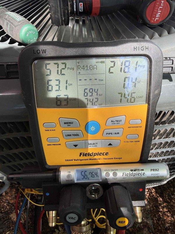 Performed AC clean and check on 410A refrigerant system. Found dirty condenser coil which was thoroughly cleaned to restore proper heat transfer efficiency. Identified leaking Schrader valve causing refrigerant loss; tightened valve to stop leak. System was low on 410A refrigerant due to the valve leak; added refrigerant to bring system to proper operating charge per manufacturer specifications. Verified system pressures and temperatures using manifold gauges, confirming unit returned to normal operating parameters.