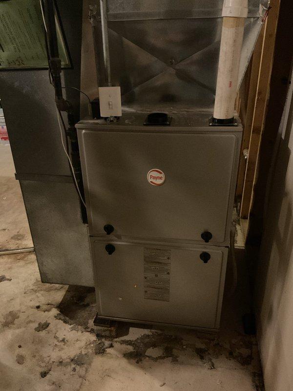 Performed clean and check service on 24-year-old Payne air conditioning system. Completed thorough inspection of outdoor condenser unit and indoor furnace components. System operating properly with no issues identified during service visit.
