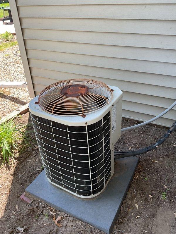 Responded to no cooling call on residential air conditioning system. Upon arrival, found outdoor condenser unit not operating with both compressor and fan inoperative. Diagnosed electrical issue as tripped circuit breaker at main panel. Reset breaker to ON position and verified system startup. Condenser unit resumed normal operation with compressor and outdoor fan running properly. System tested and confirmed cooling cycle functioning as designed at time of departure.