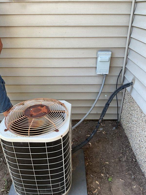 Responded to no cooling call on residential air conditioning system. Upon arrival, found outdoor condenser unit not operating with both compressor and fan inoperative. Diagnosed electrical issue as tripped circuit breaker at main panel. Reset breaker to ON position and verified system startup. Condenser unit resumed normal operation with compressor and outdoor fan running properly. System tested and confirmed cooling cycle functioning as designed at time of departure.