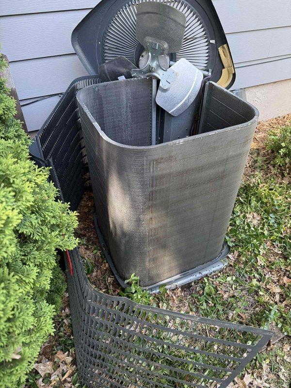 Performed annual cooling maintenance on a 5-year-old Goodman 2.5 ton, 13 SEER air conditioning condenser unit. Upon inspection, found the condenser coil heavily soiled with debris and the system operating with low refrigerant charge. Thoroughly cleaned the condenser coil to restore proper airflow and heat transfer efficiency, then added 1 pound of refrigerant to bring the system to proper operating charge.