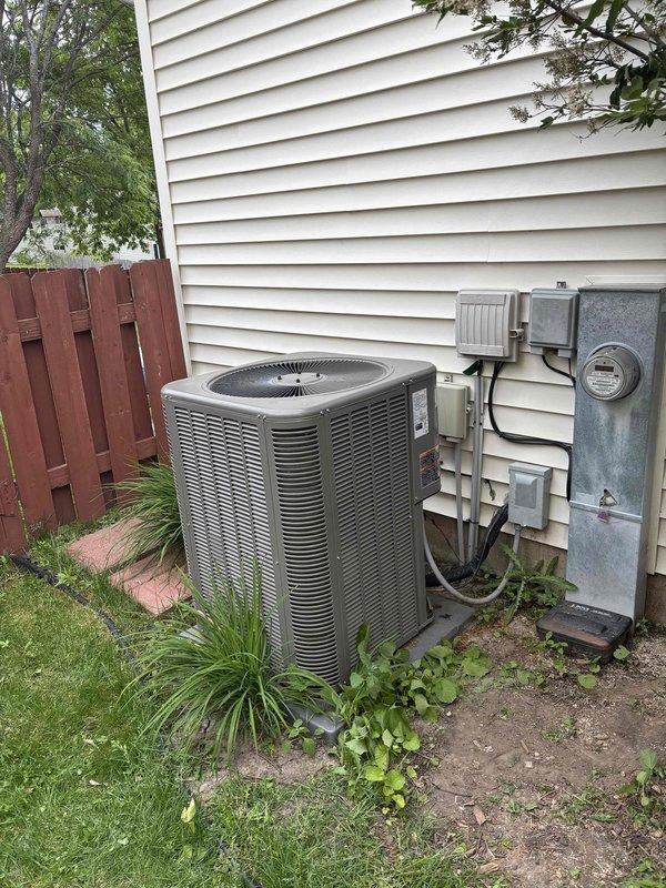 Performed seasonal start-up on recently installed air conditioning system. During inspection, discovered a leaking 3/4" copper street 90 fitting in basement. Unsweat the defective fitting, cleaned joint surfaces, and resoldered connection to eliminate refrigerant leak. Verified system pressures and temperatures using manifold gauges, confirmed proper refrigerant charge, and ensured all connections were secure and leak-free.