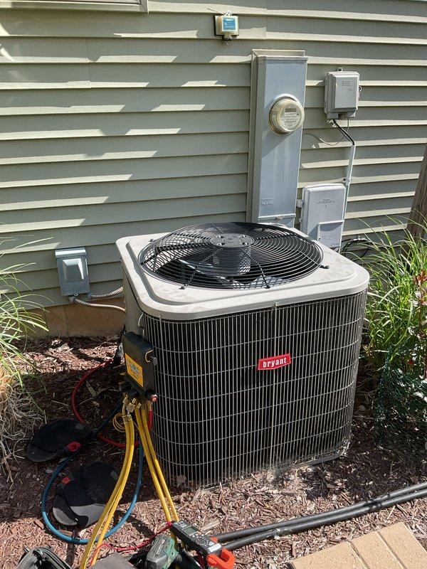Responded to service call for air conditioning unit not working correctly with loud banging noise from fan or blower motor. Upon arrival, inspected Bryant brand outdoor condenser unit and identified the source of the noise. Performed diagnostic evaluation of the blower motor assembly and fan components through the protective wire guard. Assessed mechanical and electrical connections to determine the cause of the malfunction. Used refrigerant gauges and testing equipment to verify system operation and ensure proper functionality of the unit.