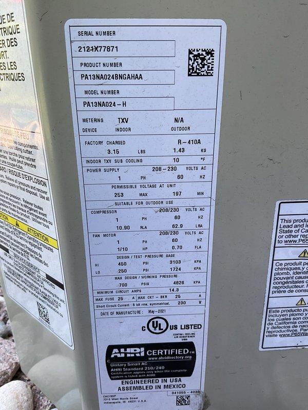 Completed seasonal A/C clean and check on Payne model PA13NA024-H condenser unit (S/N 2123X77871, manufactured May 2021) utilizing R-410A refrigerant with TXV metering. Performed comprehensive inspection of outdoor unit, verified electrical connections at disconnect box, inspected refrigerant lines, and cleaned condenser coils. Replaced furnace filter and water filter per customer request as part of routine maintenance.