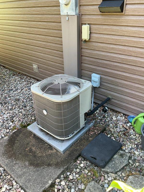 Completed seasonal A/C clean and check on Payne model PA13NA024-H condenser unit (S/N 2123X77871, manufactured May 2021) utilizing R-410A refrigerant with TXV metering. Performed comprehensive inspection of outdoor unit, verified electrical connections at disconnect box, inspected refrigerant lines, and cleaned condenser coils. Replaced furnace filter and water filter per customer request as part of routine maintenance.