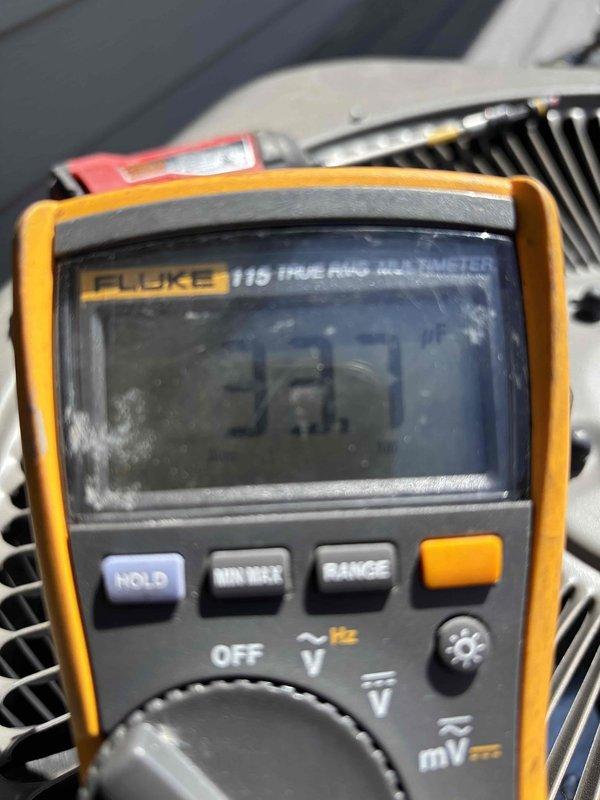 Performed comprehensive air conditioning clean and check service. Found condenser coil heavily soiled with debris, restricting airflow and reducing system efficiency. Thoroughly cleaned condenser coil to restore proper heat transfer. Verified system pressures and temperatures using refrigerant manifold gauges, confirming proper refrigerant charge and superheat levels. Measured electrical parameters with multimeter to ensure safe operating conditions. System operating within manufacturer specifications upon completion.