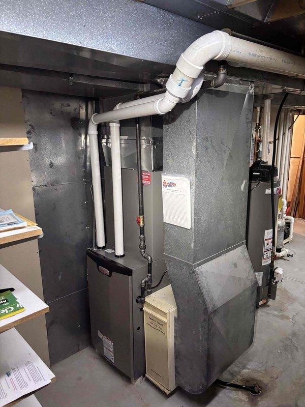 Responded to service call for continuously running blower fan following new furnace installation completed the previous day. Upon inspection, diagnosed improper dip switch configuration on control board that was preventing the fan from cycling off with thermostat calls. Corrected dip switch settings to proper position per manufacturer specifications. Verified thermostat wiring connections at Honeywell digital thermostat and furnace terminal block were secure and properly landed. Cycled system through heating mode to confirm blower now operates correctly with thermostat demand and shuts off appropriately at end of call. System operating as designed with no further issues observed.