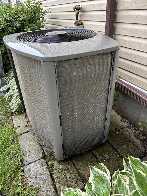Performed comprehensive air conditioning clean and check service on outdoor condenser unit. Upon inspection, found condenser coil heavily soiled with dirt and debris accumulation, restricting airflow and reducing system efficiency. Thoroughly cleaned condenser coil to restore proper heat transfer and optimal performance. Completed standard tune-up procedures to ensure unit is operating within manufacturer specifications for the cooling season.
