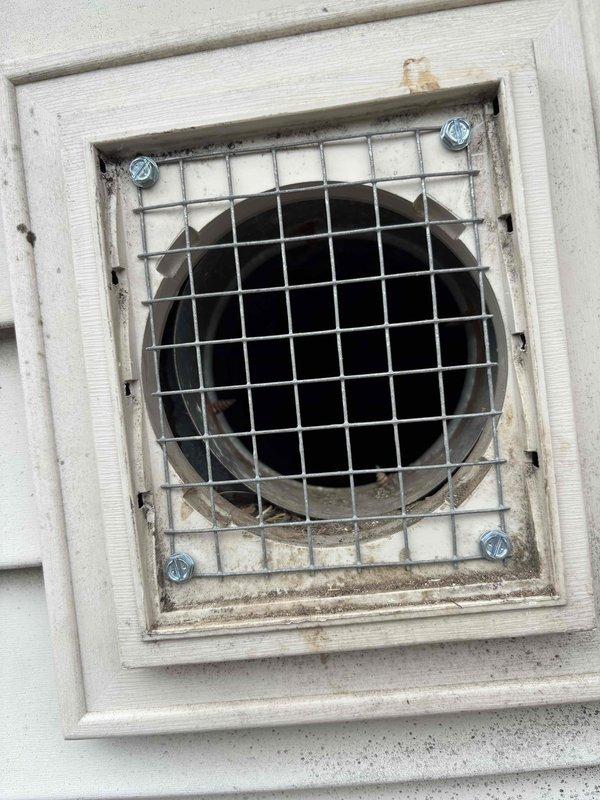 Responded to exterior bathroom vent obstruction caused by bird nesting activity. Removed bird nest debris from vent opening and interior ductwork to restore proper ventilation airflow. Installed metal wire mesh screen cover over vent opening to prevent future wildlife intrusion while maintaining adequate exhaust capacity.