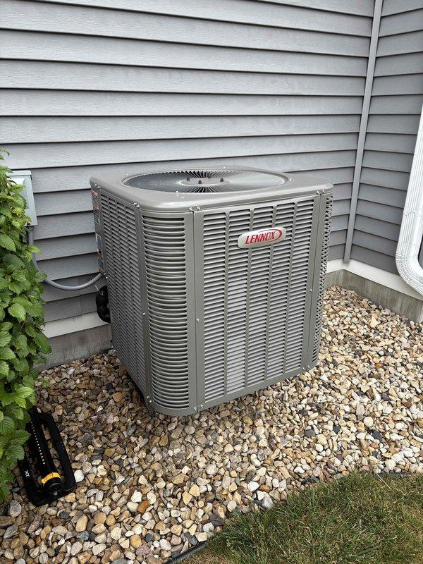 Responded to service call for Lennox air conditioning system that continued running approximately 8 minutes after reaching set temperature. Diagnosed thermostat malfunction causing delayed system shutdown. Reprogrammed thermostat to restore proper operation and cycling functionality.